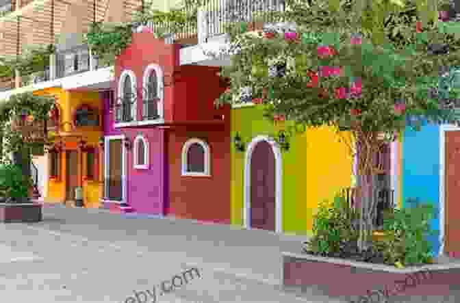 A Bustling Street Scene In Todos Santos, With Colorful Buildings And Traditional Mexican Architecture. Tales Of Todos Santos: Amusing Stories From A Small Mexican Town In The Baja