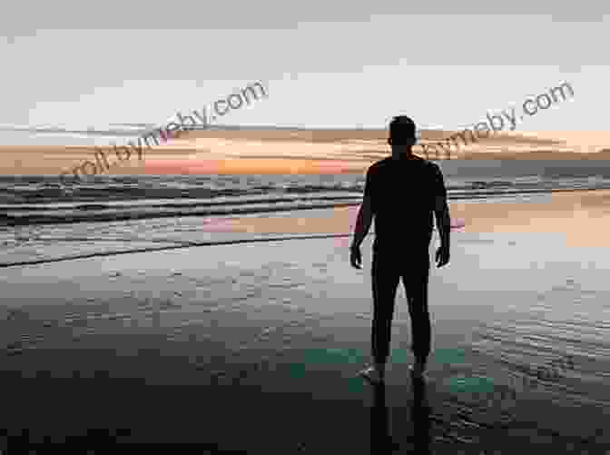 A Photo Of A Goan Man Sitting On A Beach, Looking Out At The Ocean. Susegad: The Goan Art Of Contentment