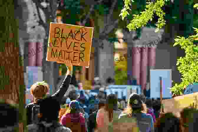 A Photograph Of A Group Of People Protesting At A #BlackLivesMatter Rally Entertaining Race: Performing Blackness In America