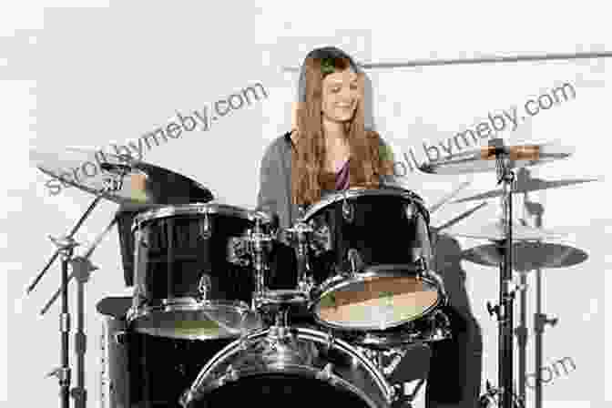 A Photograph Of A Young Girl Sitting On A Drum Set Drum City Thea Guidone