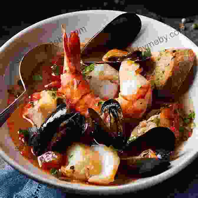 A Steaming Bowl Of Seafood Stew, Filled With Haddock, Cod, Clams, And Mussels New England Soups From The Sea: Recipes For Chowders Bisques Boils Stews And Classic Seafood Medleys